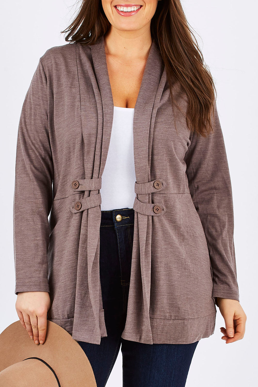 Model Tia wearing size 14 of the Merino Side Button Cardigan in colour Mocha, from the front, cropped image