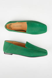 A model wearing size 37 of the Aspen Nubuck Leather Slipper in colour Green (Green), from the front, showing the whole outfit