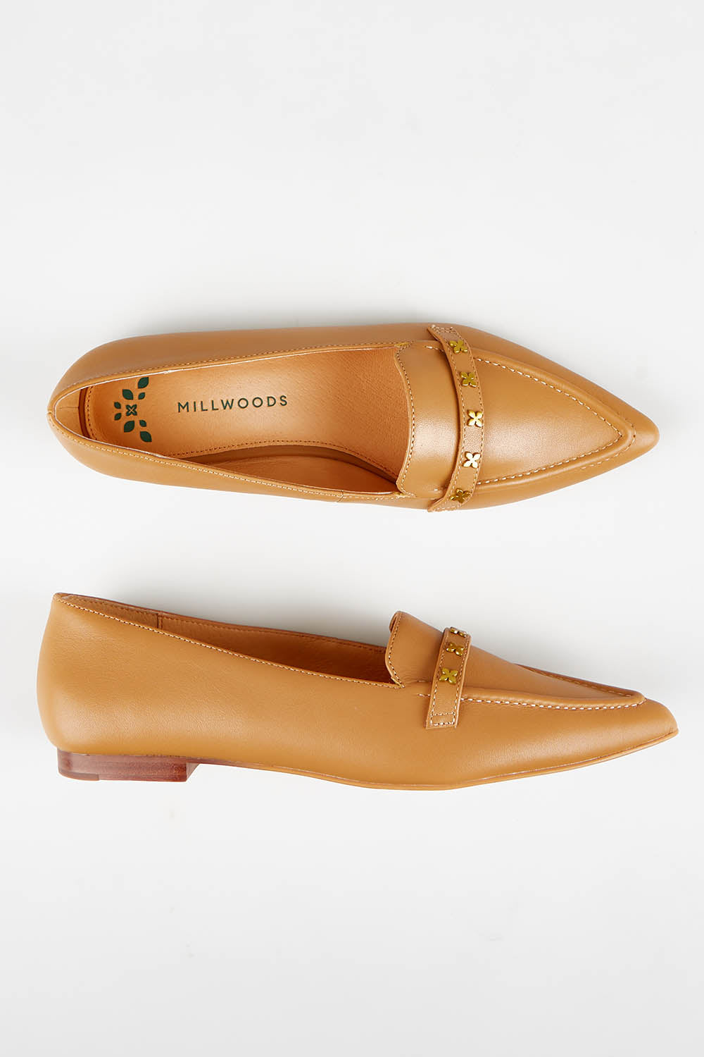 A model wearing size 37 of the Poplar Pointed Cross Leather Flat in colour Camel, from the front, showing the whole outfit