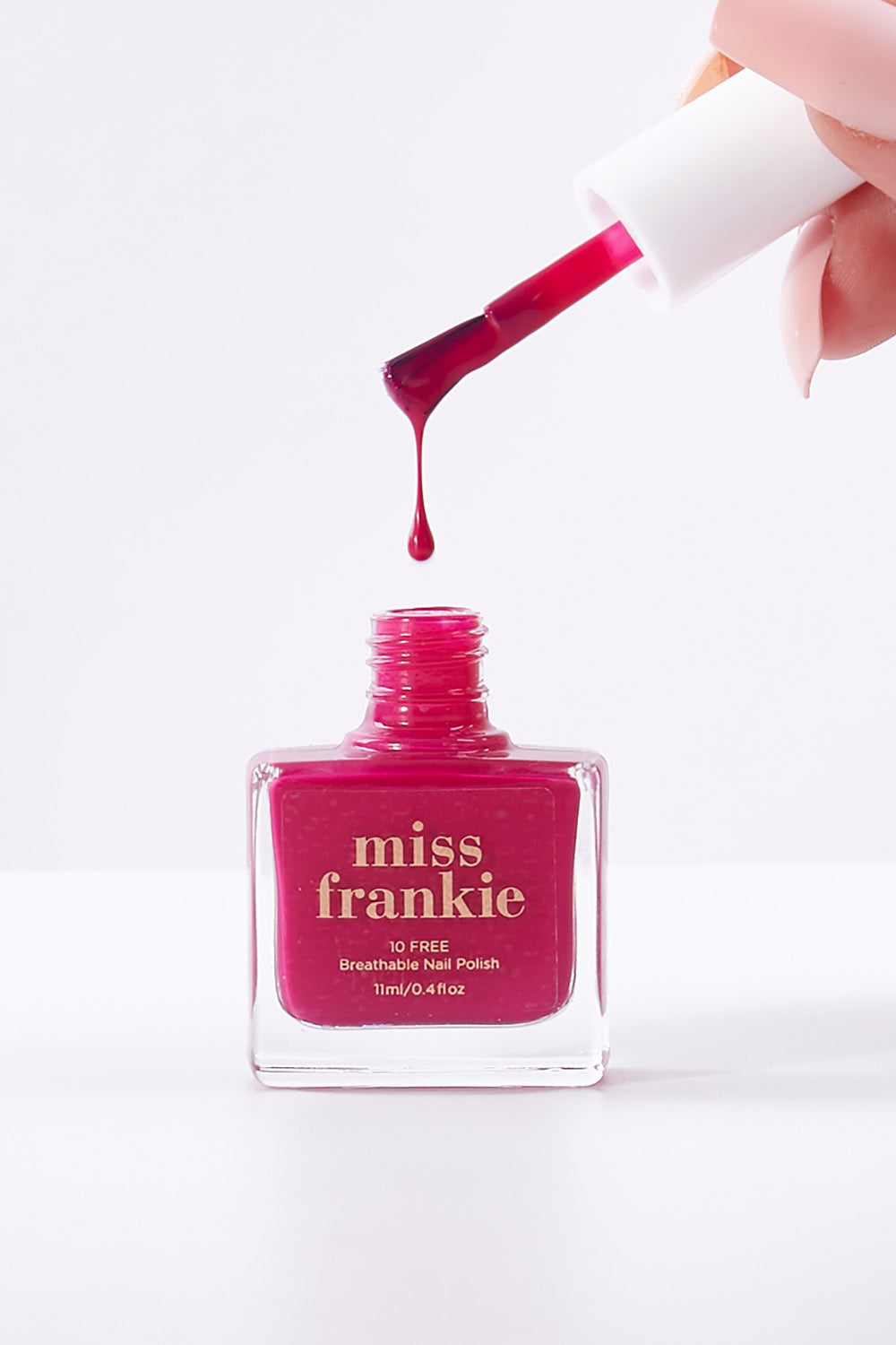 A model wearing size OneSize of the Chip Resistant Nail Polish in colour Crushonyou (Pink), from the front, showing the whole outfit