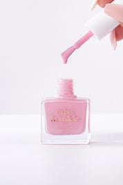 A model wearing size OneSize of the Chip Resistant Nail Polish in colour Hellolover (Pink), from the front, showing the whole outfit