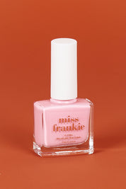 A model wearing size OneSize of the Chip Resistant Nail Polish in colour Hellolover (Pink), from the front, showing the whole outfit