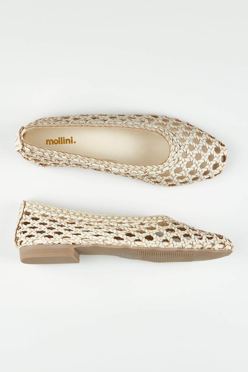 A model wearing size 37 of the Doetta Leather Woven Flat in colour Cream (White), from the front, showing the whole outfit