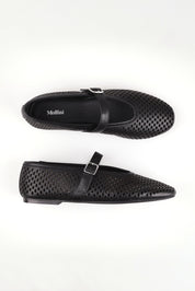 A model wearing size 37 of the Elony Leather Flat in colour Blackleath (Black), from the front, showing the whole outfit
