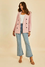 Model Madeline wearing size 40 of the Gessie Heel in colour Tan, from the front, showing the whole outfit