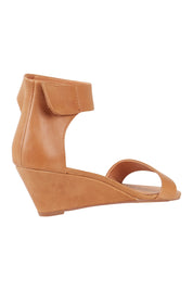 Product shot of the Marsy Wedge in colour Tan, from the back