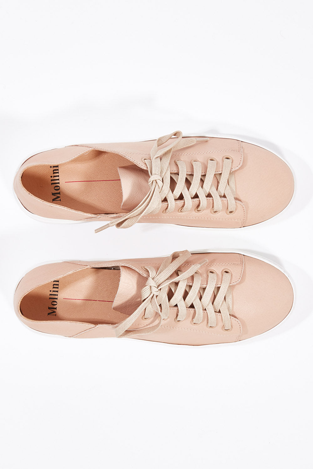 A model wearing size 36 of the Oskher Leather Sneaker in colour DarkNude (Pink), from the front, showing the whole outfit
