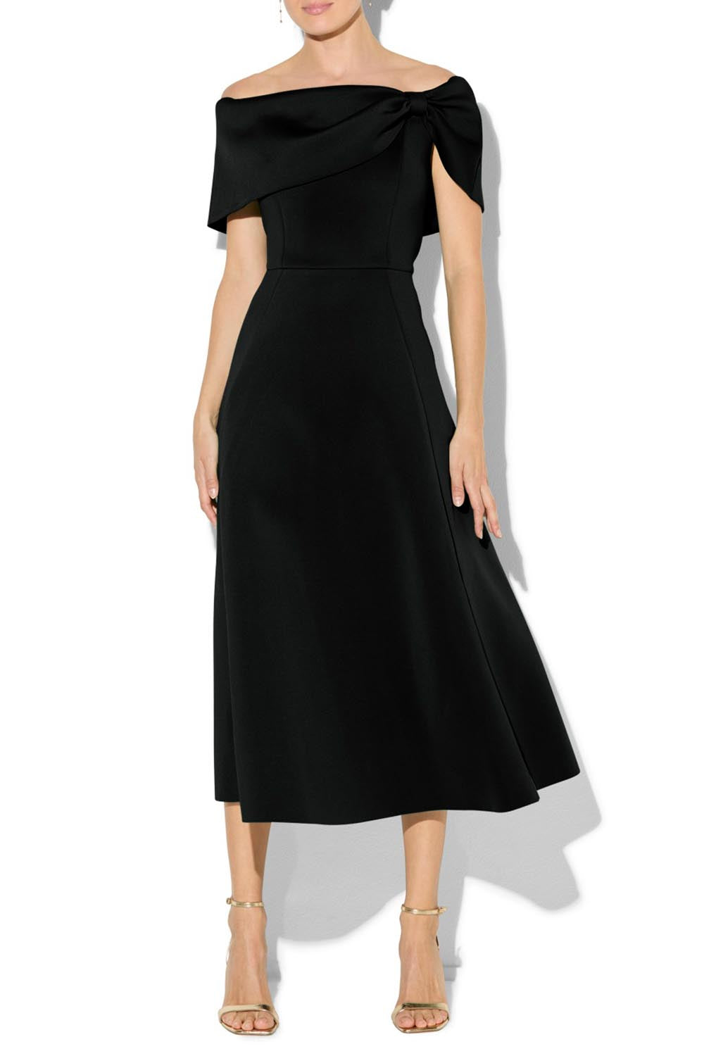A model wearing the Rowan Cocktail Dress in colour Black (Black), from the front, cropped image