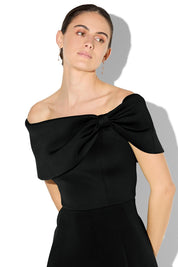 A model wearing the Rowan Cocktail Dress in colour Black (Black), from the front, cropped image