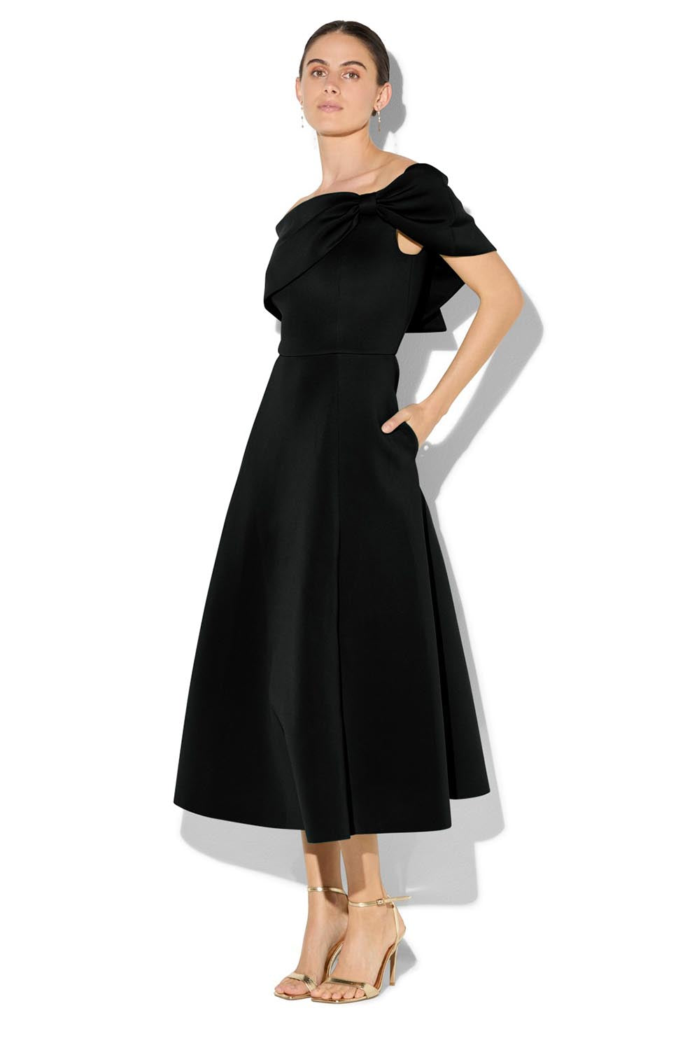 A model wearing the Rowan Cocktail Dress in colour Black (Black), from the front, showing the whole outfit