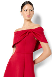 A model wearing the Rowan Cocktail Dress in colour Red (Red), from the front, cropped image