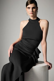 A model wearing the Sebastian Halter Gown in colour Black (Black), from the front, showing the whole outfit