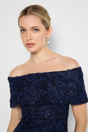 Model Genericm wearing size sample of the Emerson Off The Shoulder Gown - Navy in colour Navy, in a cropped view