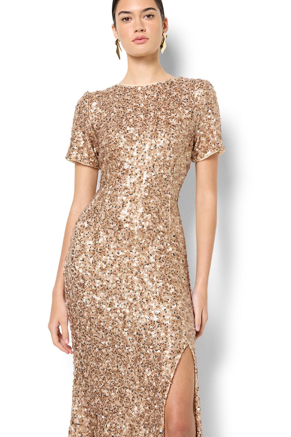 A model wearing the Colette Sequin Gown in colour Mink, from the front, cropped image