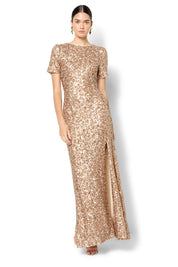 A model wearing the Colette Sequin Gown in colour Mink, from the front, showing the whole outfit