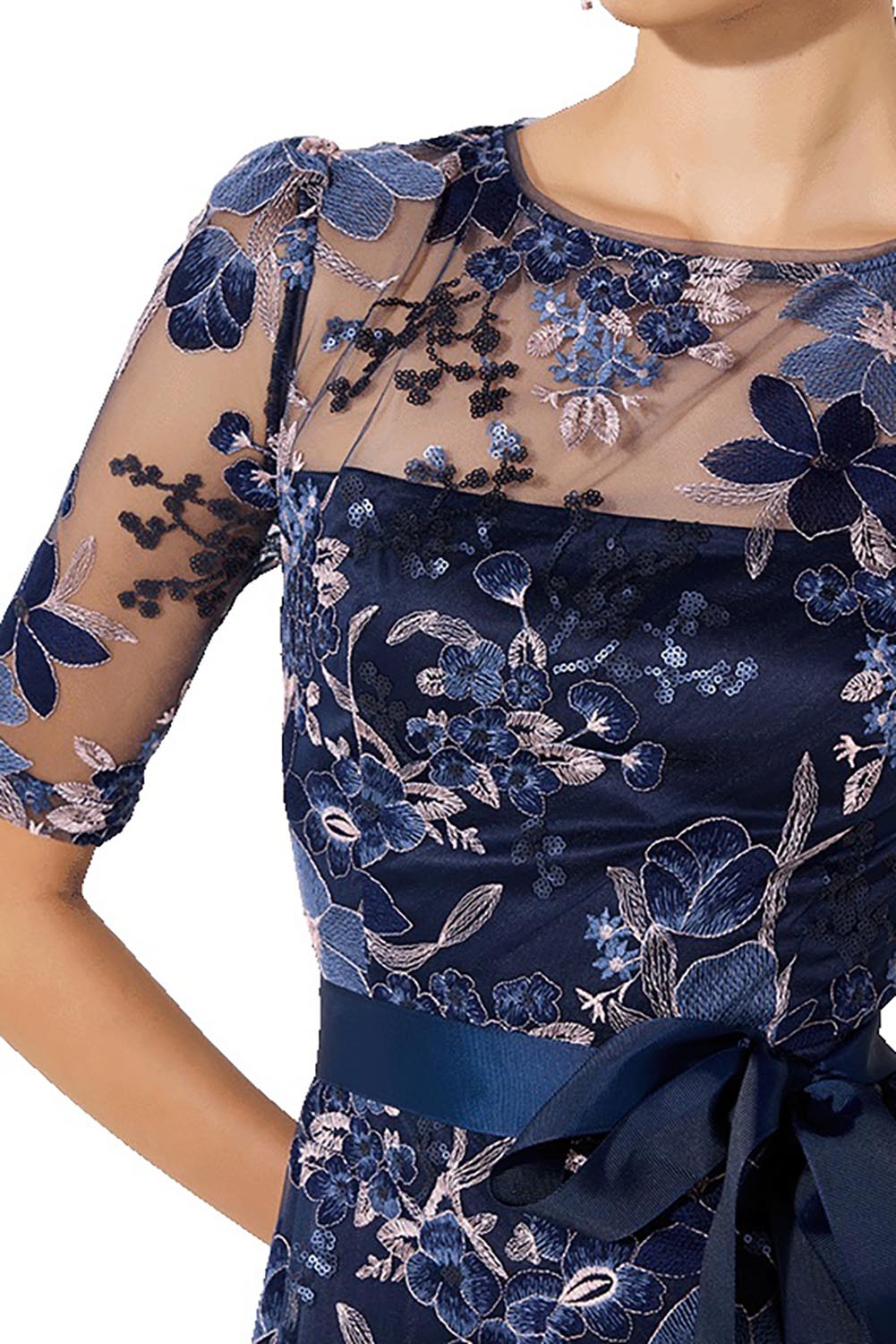 A model wearing the Loren Lace Midi Dress in colour Navypink (Blue), from the front, cropped image
