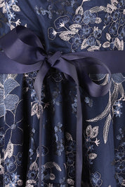 Product shot of the Loren Lace Midi Dress in colour Navypink (Blue), detail