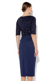 A model wearing the Reeva Sequin Cocktail Dress in colour Navy (Blue), from the back