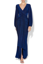 A model wearing the Serena Shimmer Maxi Gown in colour Sapphire (Blue), from the front, cropped image