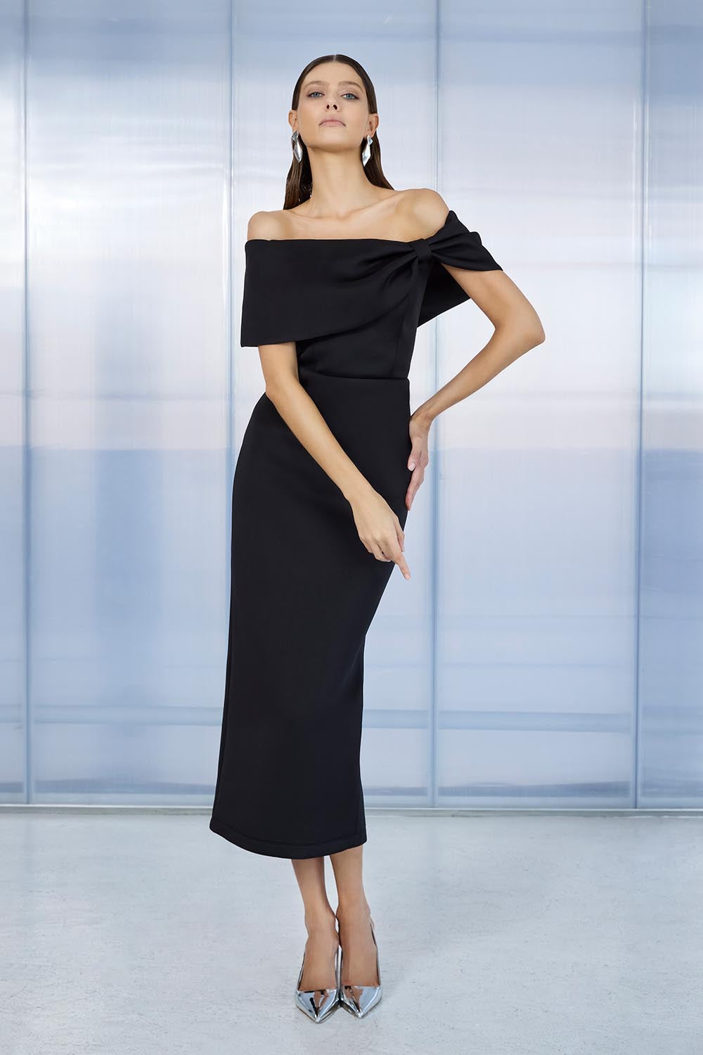 A model wearing the Finlay Cocktail Dress in colour Black (Black), from the front, showing the whole outfit