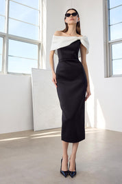 A model wearing the Finlay Cocktail Dress in colour Blackwhite (Black), from the front, showing the whole outfit