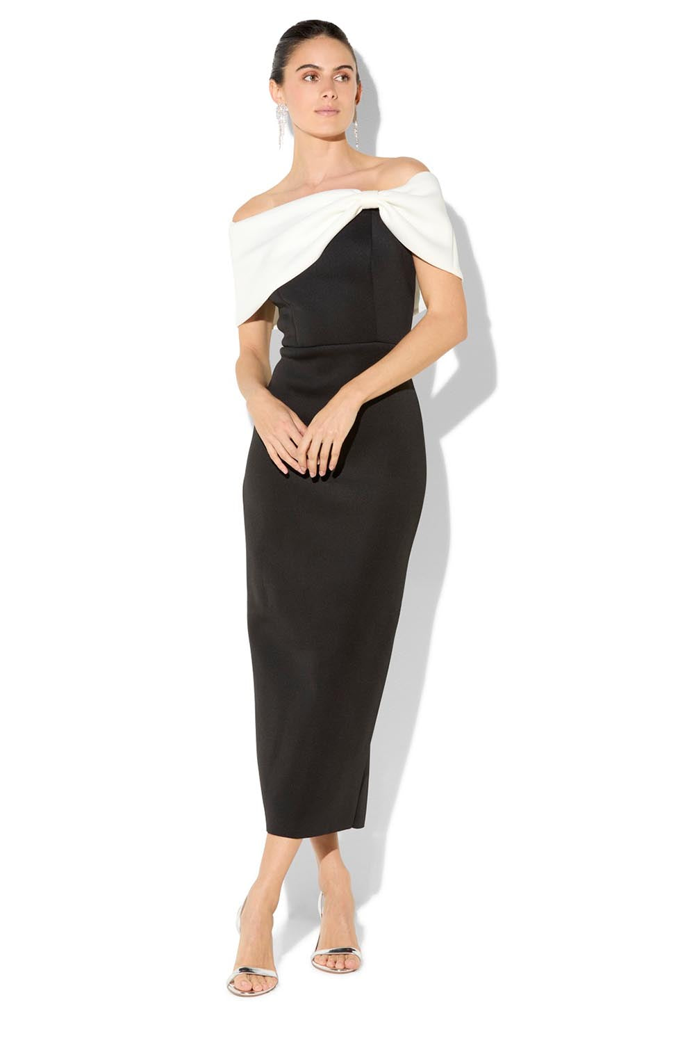 A model wearing the Finlay Cocktail Dress in colour Blackwhite (Black), from the front, showing the whole outfit