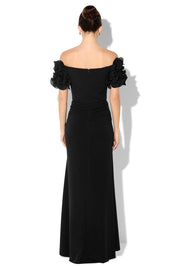 A model wearing the Diana Ruffle Sleeve Gown in colour Black (Black), from the back
