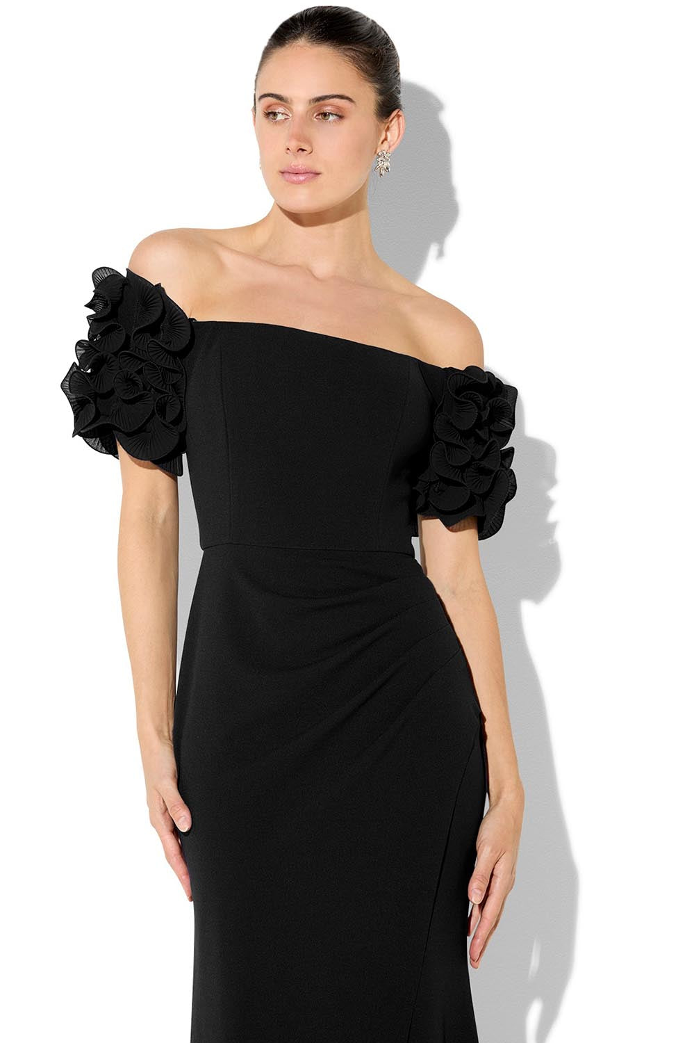 A model wearing the Diana Ruffle Sleeve Gown in colour Black (Black), from the front, cropped image