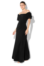 A model wearing the Diana Ruffle Sleeve Gown in colour Black (Black), from the front, showing the whole outfit