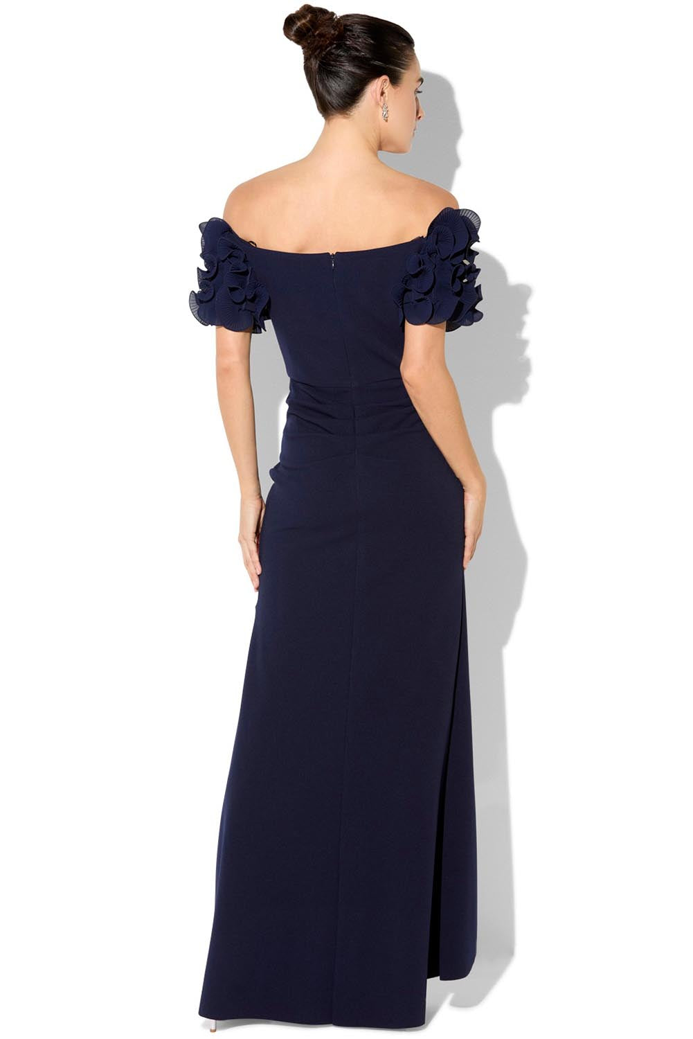 A model wearing the Diana Ruffle Sleeve Gown in colour Navy (Blue), from the back