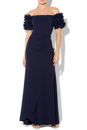 A model wearing the Diana Ruffle Sleeve Gown in colour Navy (Blue), from the front, cropped image