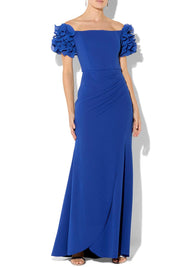 A model wearing the Diana Ruffle Sleeve Gown in colour Sapphire (Blue), from the front, cropped image