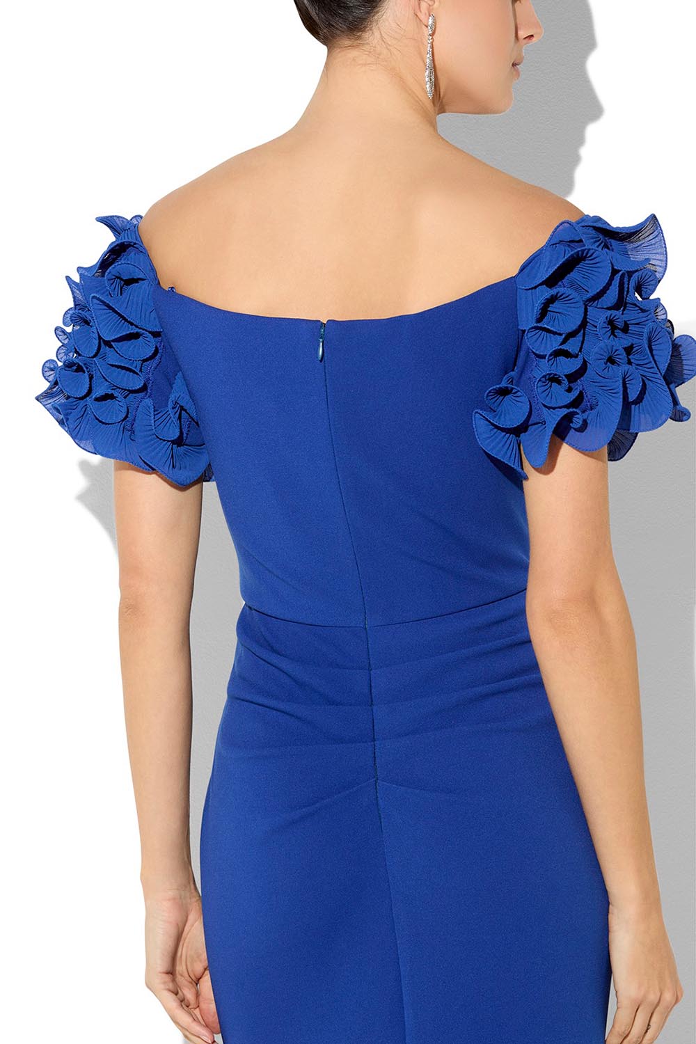 A model wearing the Diana Ruffle Sleeve Gown in colour Sapphire (Blue), from the front, cropped image