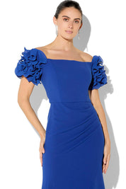 A model wearing the Diana Ruffle Sleeve Gown in colour Sapphire (Blue), from the front, cropped image