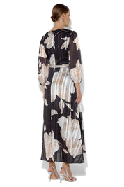 A model wearing the Soraya Printed Maxi Dress in colour Blackprint (Black), from the back