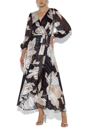 A model wearing the Soraya Printed Maxi Dress in colour Blackprint (Black), from the front, cropped image