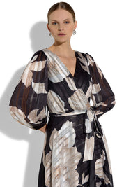 A model wearing the Soraya Printed Maxi Dress in colour Blackprint (Black), from the front, cropped image