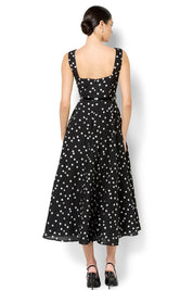 A model wearing the Ascot Dot Dress in colour Blkwhtdot (Black), from the back