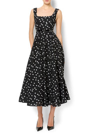 A model wearing the Ascot Dot Dress in colour Blkwhtdot (Black), from the front, cropped image