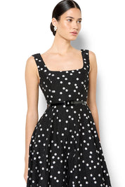 A model wearing the Ascot Dot Dress in colour Blkwhtdot (Black), from the front, cropped image
