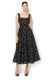 A model wearing the Ascot Dot Dress in colour Blkwhtdot (Black), from the front, showing the whole outfit