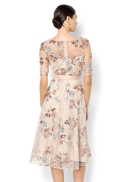 A model wearing the Pippa Embroidered Dress in colour Mink (Pink), from the back
