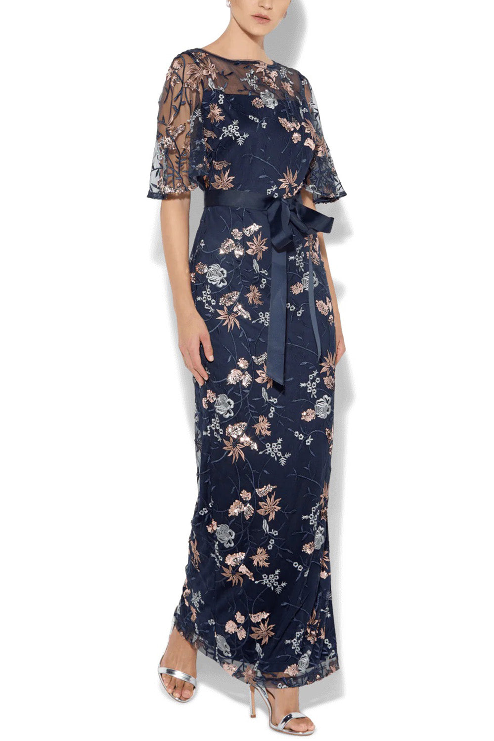 A model wearing the Florence Navy Embroidered Gown in colour Navy (Blue), from the front, cropped image