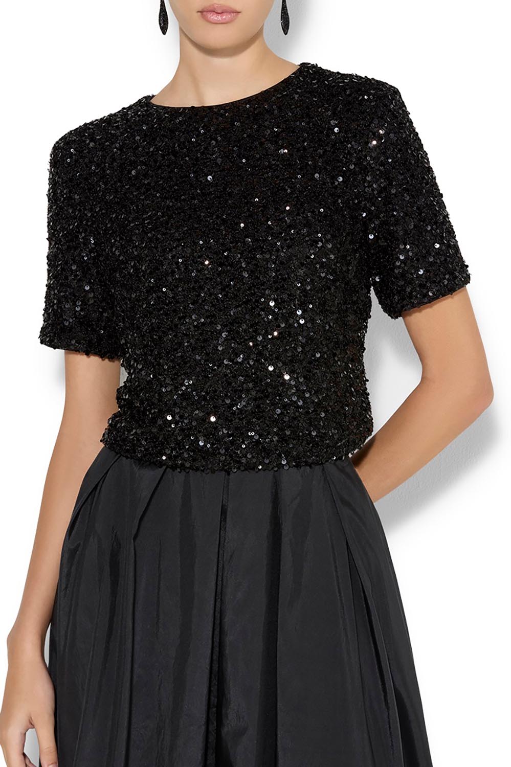 A model wearing the Ginger Sequin Top in colour Black (Black), from the front, cropped image