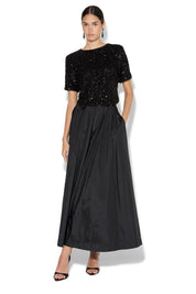 A model wearing the Ginger Sequin Top in colour Black (Black), from the front, showing the whole outfit