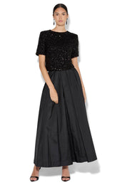 A model wearing the Ginger Sequin Top in colour Black (Black), from the front, showing the whole outfit