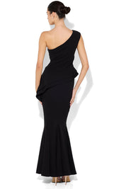 A model wearing the Oscar One Shoulder Gown in colour Black (Black), from the back