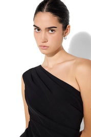 A model wearing the Oscar One Shoulder Gown in colour Black (Black), from the front, cropped image