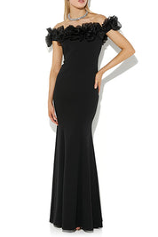A model wearing the Mischa Organza Rose Gown in colour Black (Black), from the front, cropped image