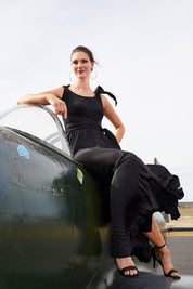 Model Anneliese wearing size 10 of the Chloe Dress in colour Black (Black), from the front, showing the whole outfit